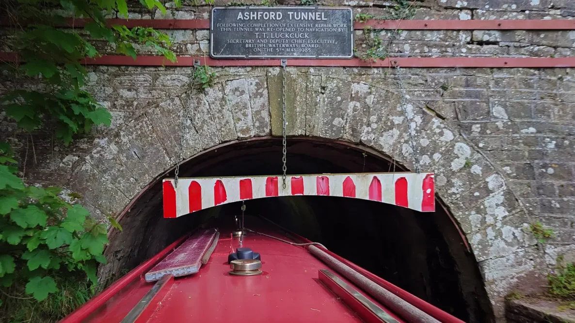 Narrowboat entering the Ashford Tunnel on the Mon and Brec canal